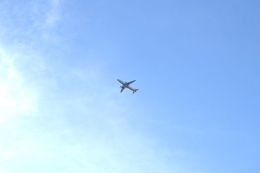 Plane flying in blue sky, travel concept, Empty copy space