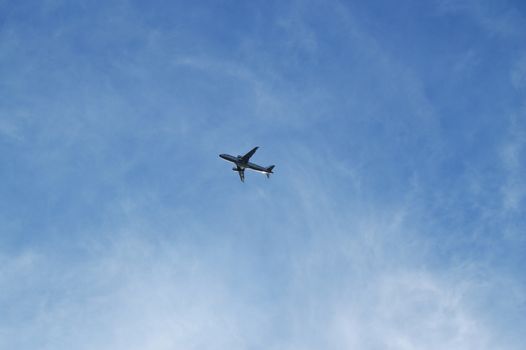 Plane flying in blue sky, travel concept, Empty copy space