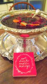 Christmas cocktail punch in Silver holiday serving bowl eat drink be merry