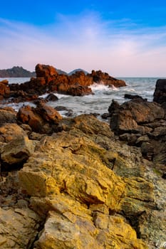 Beach sunset scene at dusk, long exposure shot.