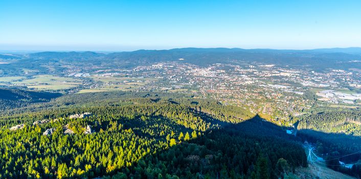 Aerial view of Liberec city and Jizera Mountains from Jested Mountain on sunny summer evening. Czech Republic.