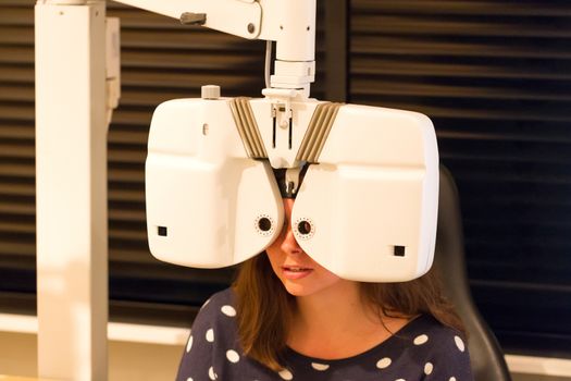 Optometrist doing sight testing for patient - the Netherlands