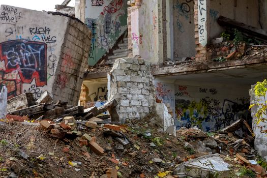 Demolition of white bricks building. White bricks house in ruins. Saldus, Latvia.