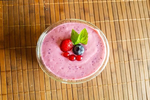 Low calorie food. Fresh healthy blueberries raspberries and redcurrants smoothie