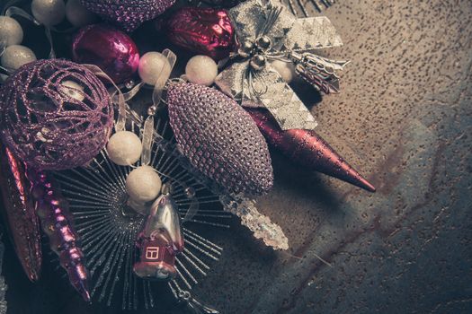 vintage christmas 2019 background with colorful toys on dark surface