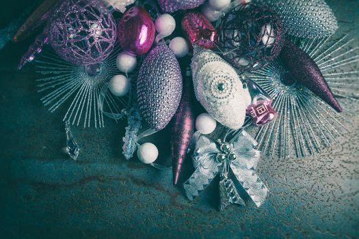 vintage christmas 2019 background with colorful toys on dark surface