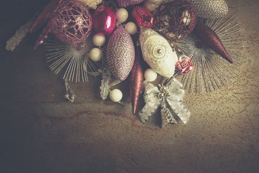 vintage christmas 2019 background with colorful toys on dark surface