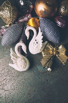 vintage christmas 2019 background with colorful toys on dark surface