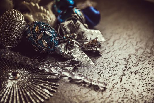 Beautiful silver and blue christmas balls for 2019 New Year on a dark background. Copy space