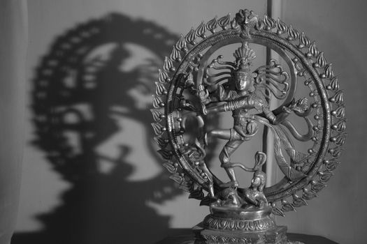 An antique metal sculpture of the dancing god Shiva also known as the Natraj or Natraja, woshipped by dancers following traditional danceforms of India.