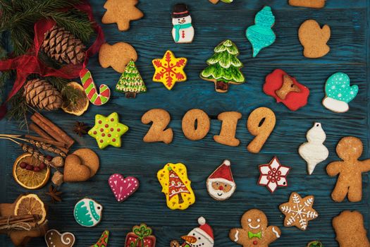Gingerbreads for new 2019 year holiday on wooden background, xmas theme