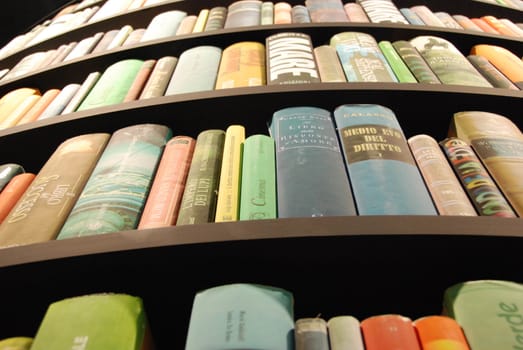 Books in a tower-shaped bookcase