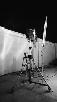 Black and white images of big studio continue LED light for video or film movie production on professional strong steel tripod and promt for shooting or set framing for director