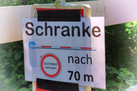 Caution barrier signs or traffic signs with German inscription - caution barrier passage prohibited with Vignette Lens