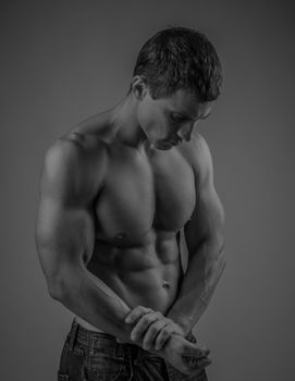 Muscular and fit young man posing shirtless