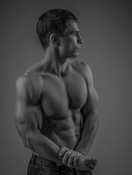 Muscular and fit young man posing shirtless