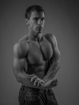 Muscular and fit young man posing shirtless