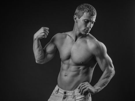 Muscular and fit young man posing shirtless