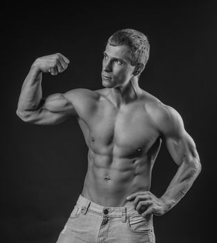 Muscular and fit young man posing shirtless