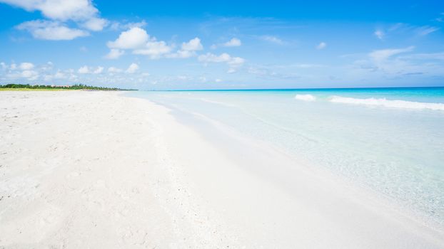 Beautiful beach of Varadero during a sunny day, fine white sand and turquoise and blue Caribbean sea,sky with clouds,Cuba.