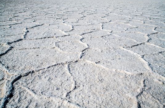 close view of the Bad Water salt field in the lowest point of North America. An impressive atmosphere in the huge valley copmpletely covered by salt. Arid climat