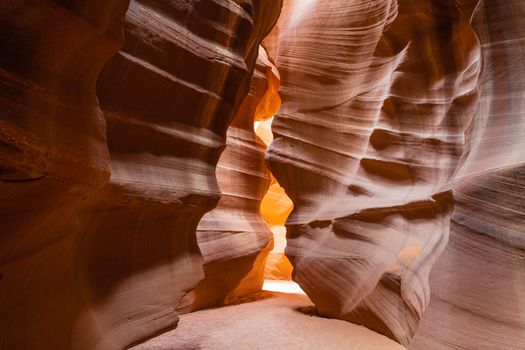 Beautiful stonesand rock formation erosed by the wind and the water. A stone stripped texture with colours that change with the sunlight from gold to red, purple, orange and blu