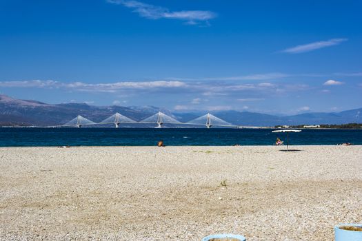 Remote view of Rio-Antirio bridge at daylight, Greece. The Rio Antirrio Bridge is one of the world's longest multi-span cable-stayed bridges.