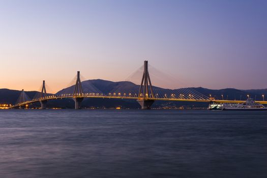 View of Rio-Antirio bridge at dusk, Greece. The Rio Antirrio Bridge is one of the world's longest multi-span cable-stayed bridges.