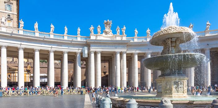 ROME, VATICAN STATE - AUGUST 24, 2018: long line of people waiting in front of Saint Peter Basilica entrance. Concept for overtourism and mass-tourism.