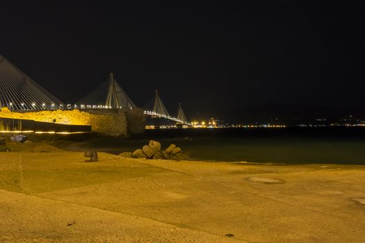 View of Rio-Antirio bridge at night, Greece. The Rio Antirrio Bridge is one of the world's longest multi-span cable-stayed bridges.