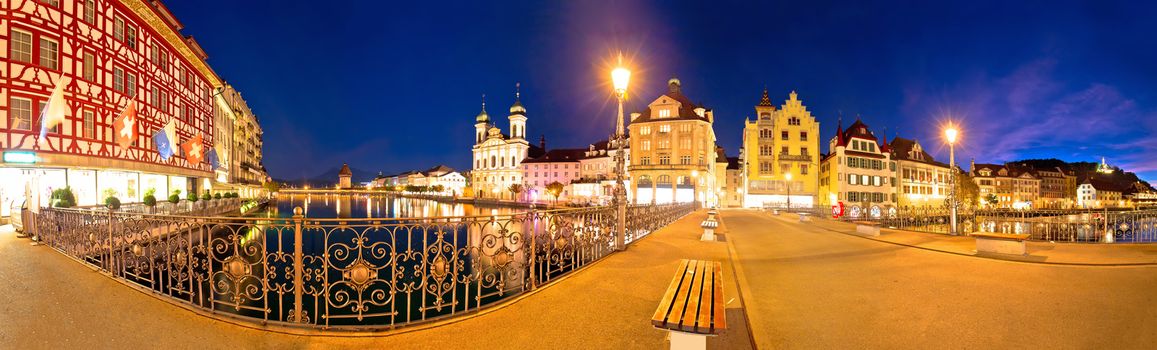 Luzern panoramic evening view of famous landmarks and Reuss river, central Switzerland