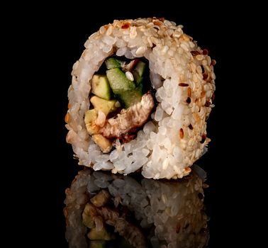 Single sushi roll california rotated. Black background. Reflection