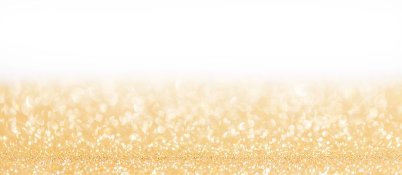 Golden decorative glitters on white background