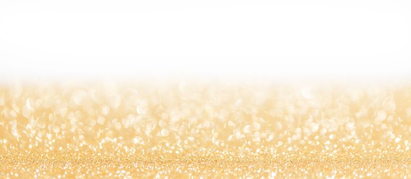 Golden decorative glitters on white background