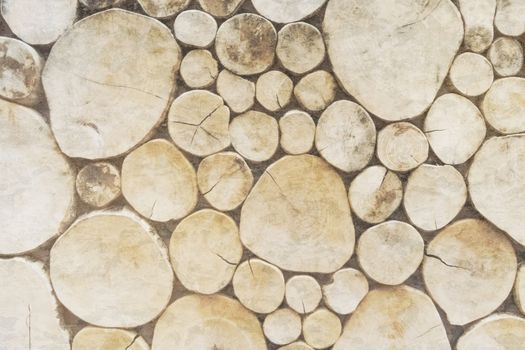 Woodpile of mixed firewood vintage texture background tree