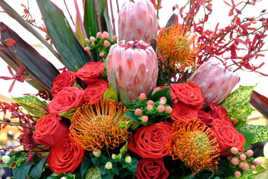 
Luxury bouquet of fresh flowers protea and roses. Boho style Close up.
