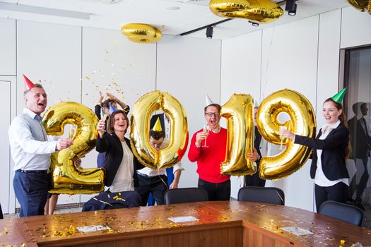 Business people celebrating 2019 New Year at office party