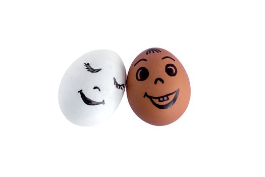 Funny eggs imitating a couple of happy smiling lovers on white background