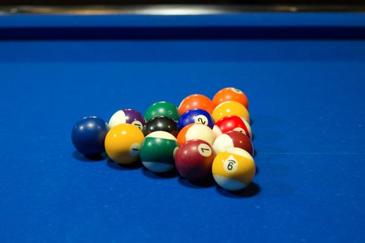 Billiard pool game in progress, balls in starting triangular position