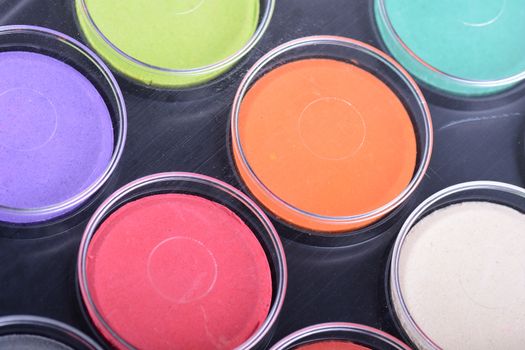 Paint pots in assorted colors. close up