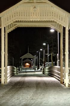 Long lighted bridge at night in Helsinki, Finland