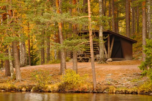 Resting cabin of a national park by the lake in autumn.