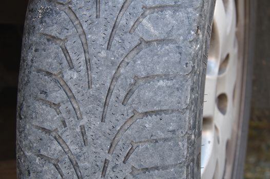 Worn out winter tire of a car.