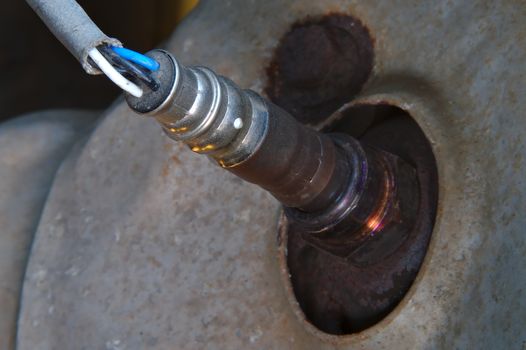Heated oxygen sensor in the exhaust of a car with combustion engine