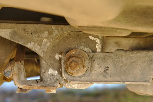 Rusty mount of a rear axle of a front wheel drive car.