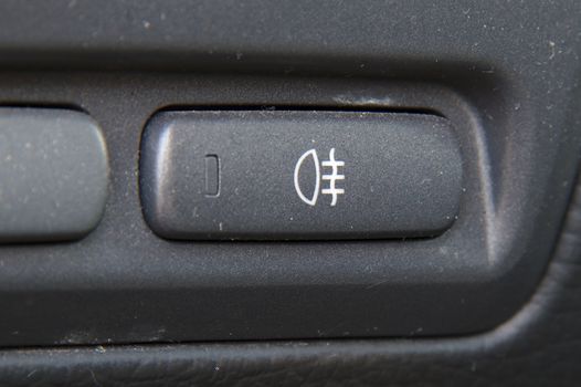 Rear fog lights switch in the dashboard of a car.