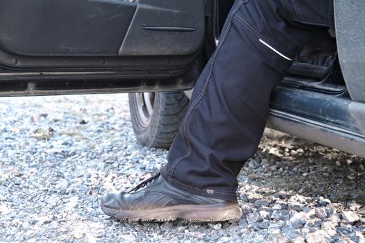 Man stepping out of the vehicle.