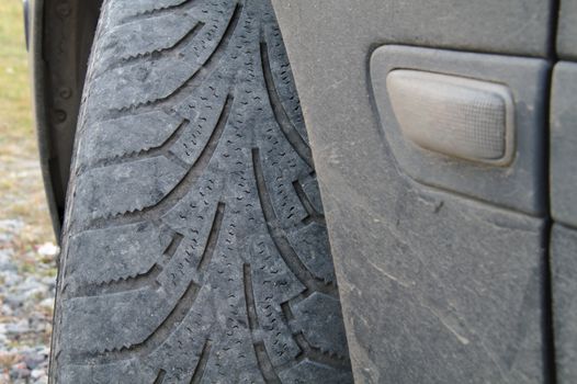 Worn out front tire of a car.
