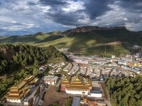 The bird-view of  Langmu Temple with rainbow and Red Cliff in the Zoige County,Sichuan Province,and Luqu County,Gannan Tibetan Prefecture,Gansu Province.