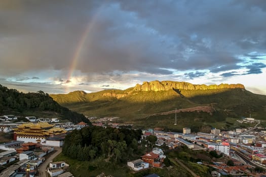 The bird-view of  Langmu Temple with rainbow and Red Cliff in the Zoige County,Sichuan Province,and Luqu County,Gannan Tibetan Prefecture,Gansu Province.